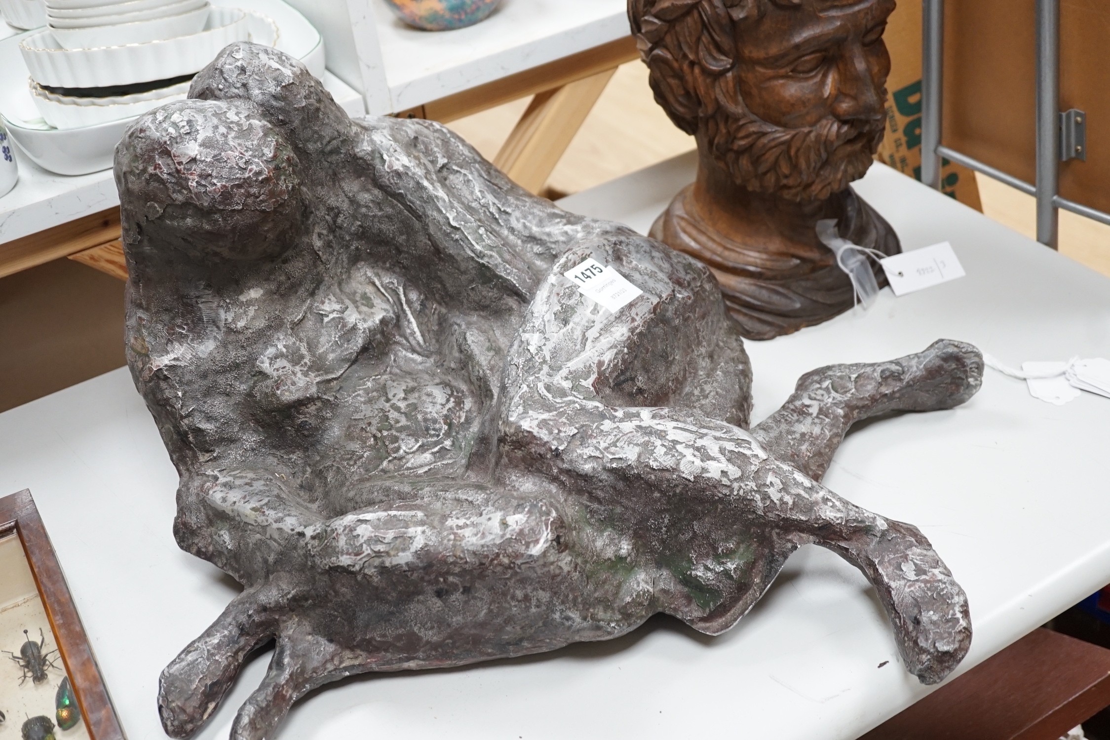 A large heavy cast metal abstract figure group, recumbent couple, 67cm